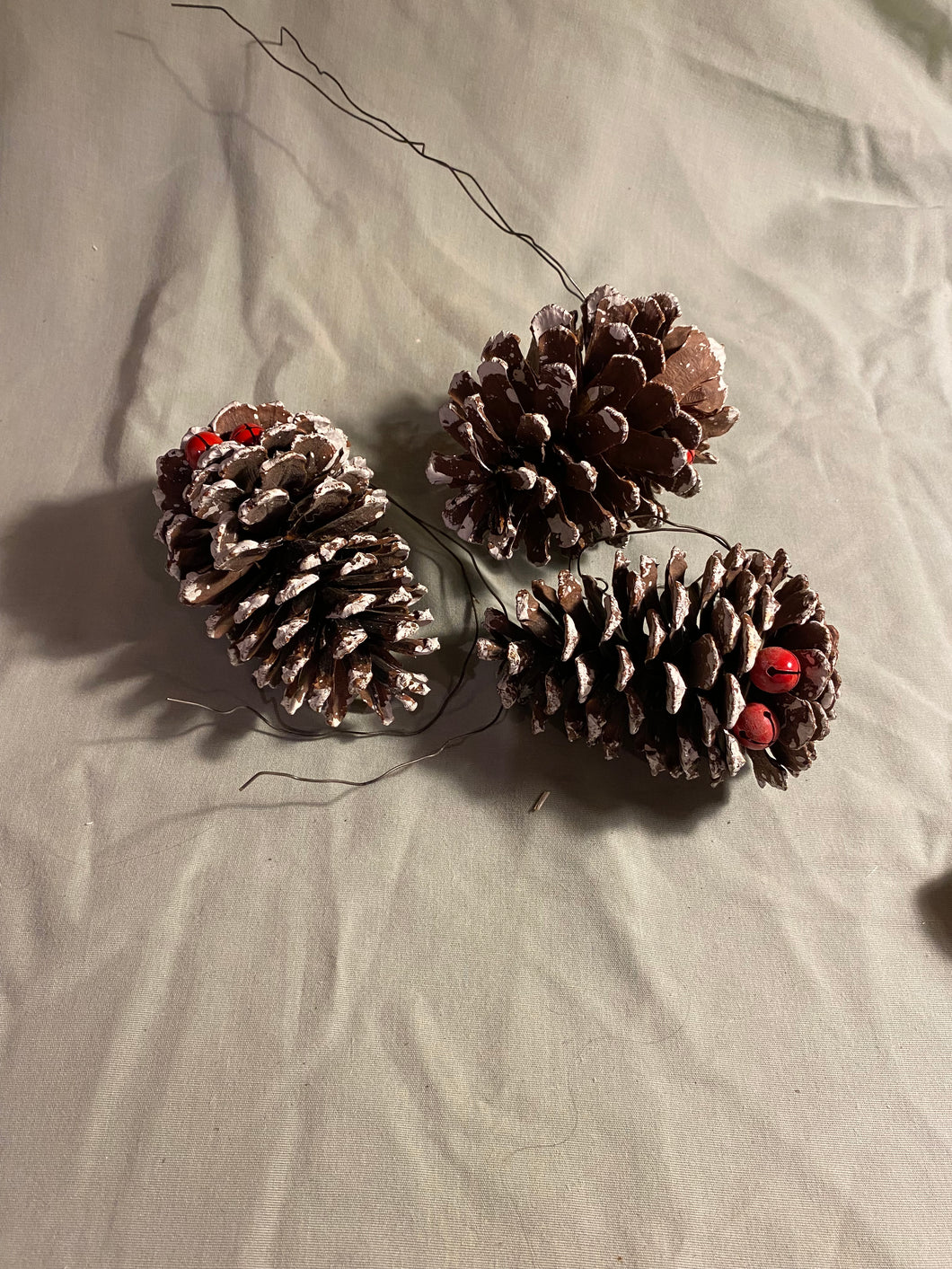 Large Pinecone with bell and snow